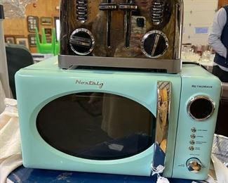 Toaster, microwave, and new white compact fridge below!