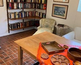 Vintage books from 1940-1980, original watercolors, upholstered chaise lounge, and a sinker cypress farmhouse table 42”x83” made by Louisiana craftsman Shelton Laney
