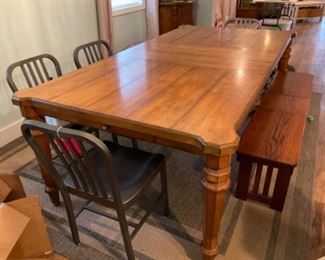 Dining table with 2 leaves extends to 104 inches