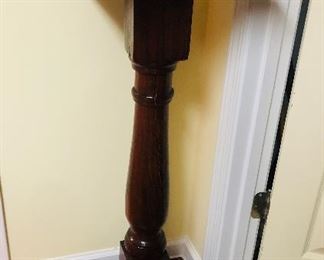 This is a hand made fern stand. The base and top as well as the old newel appear to be heart pine. 