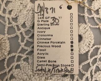 B Gould hand made necklace 
Sodalite knack beads, fossils , precious woods and Chinese porcelain 