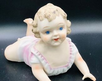 Sweet Vintage Bisque Porcelain Piano Baby girl in a pink gown with white trim and blonde curly hair, she has hand painted features with blue eyes. ...