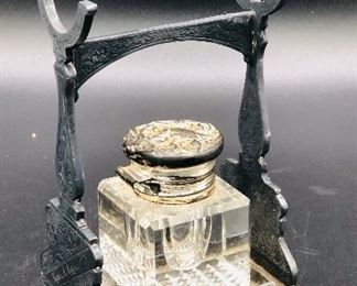 Antique Inkwell & Pen Holder 


Cast Iron Frame Glass Bottle dated with name 125
May 27 1886
——- T Hopkins