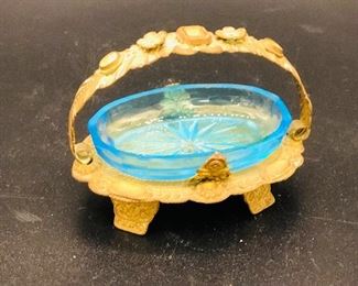Blue glass salt cellar in a gold metal basket