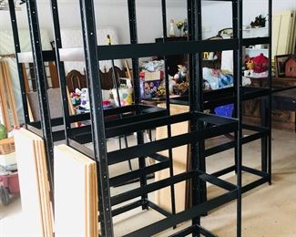 Three black metal shelves 