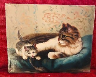 Oil painting of a cat and her kitten at ease on a pillow. 