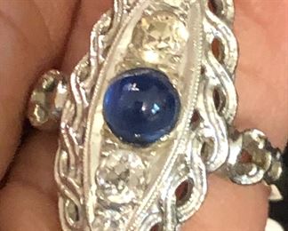 Dinner ring. 
2- 1/8 carat diamonds 
2-1/4 carat diamonds
1/2 carat saffire
14k 
Size 6.5