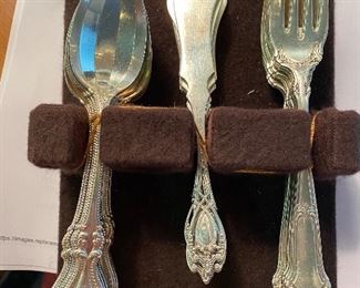 Antique sterling sets of spoons, butter knives and forks. different patterns. 