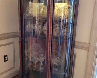 Lovely bow glass front China cabinet with mirrored back and wooden shelves