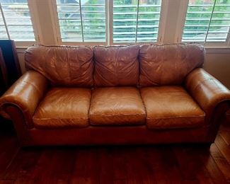 Rustic brown leather couch
Craftwork 
A Vanguard Company