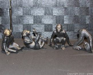 Four Cast Iron Unique Monkey Figurines