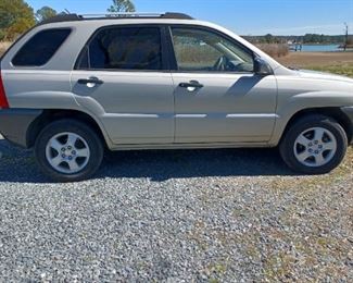 Gold 2007 Kia sportage, 5 speed. 159,000mi., New tires, brakes and belts. 1 owner has all maintenance records available, clean title,