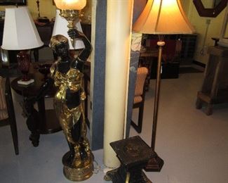 Pair of torch holding figures for the front entrance way of a grand building