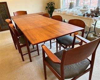 	#1	Vintage Danish teak modern dining table with 2 pull out leaves and 6 chairs + one extra.  51-94x35x29	 $600.00 				