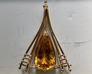 One of a kind design by jeweler, Jo Jennings.  14 kt. gold and citrine pendant.  Matching ring as well as many other pieces available.