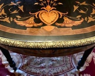 Detail
Victorian style marquetry library table, ormolu mounts & edge, musical and bird motif, made in Italy, 20th c,     55.25” x 30.5” x 30.5”
Was $1600
Now $500