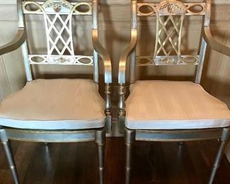 Maitland Smith, 
pair Regency style chairs
Silver and gold finish with cane seats cream moiré cushions. 
21” x 24.5” x 35.5” h seat 19.5” h

Was $1800 pair
Now $600 pair
