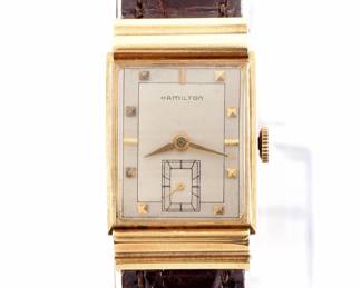 Lot 23: A vintage Hamilton 18k Gold "Gordon B" model gentleman's wristwatch.  Manual wind, 19j, 754 movement with a Silvered dial, Square pyramidal/Baton markers and subsidiary seconds, serial #30043H.  22 x 36 mm 18k Yellow Gold case with a replaced leather band.  33.5 grams total weight.  Slight wear, winds, sets and running when cataloged.  ESTIMATE $800-1,200
