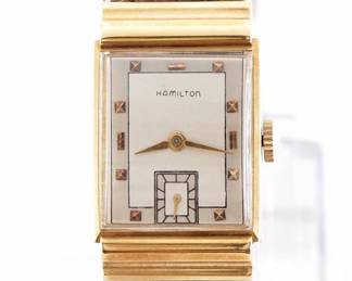 Lot 26: A vintage Hamilton 18k Gold "Gordon" model gentleman's wristwatch.  Manual wind, 19j, 982 movement with a Silvered dial, Square pyramidal/Baton markers and subsidiary seconds, serial #M134948.  22 x 36 mm 18k Yellow Gold case with a replaced leather band.  31.9 grams total weight.  Slight wear, winds, sets and running when cataloged.  ESTIMATE $800-1,200
