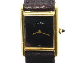 Lot 32: A vintage Cartier 14k Gold gentleman's wristwatch.  Manual wind movement with Black dial marked "Cartier, Swiss" no markers.  23 x 33 mm 14k Rose Gold case with a replaced leather band.  28.7 grams total weight.  Case wear, winds, sets and running when cataloged.  ESTIMATE $2,000-3,000
