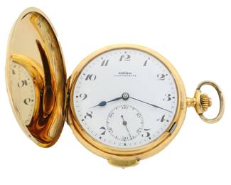 Lot 36: An 18k Gold Vulcain Swiss pocket watch with button activated minute repeat.  50 mm, 18k Gold engine turned HC, porcelain SSD with Arabic numerals marked "Vulcain, Chrometre", serial #263054.  87.21 grams total weight.  Minor wear, tiny dents, monogram, winds, sets and running when cataloged.  ESTIMATE $2,000-3,000
