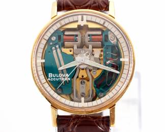 Lot 48: A vintage Bulova Accutron 18k Gold M4 "Spaceview" model gentleman's wristwatch.  Skeletonized Quartz movement with sweep seconds, Bulova Accutron crystal, rear set, serial #1-265016.  34 mm 18k Yellow Gold case on a "Accutron" leather band with vintage Bulova GF buckle.  44.8 grams total weight.  Slight wear, winds, sets and running when cataloged.  ESTIMATE $2,000-3,000
