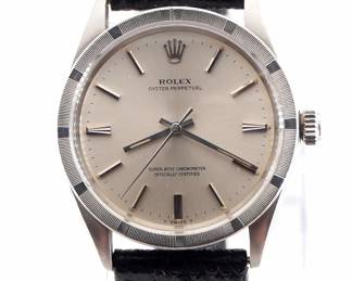 Lot 55: A late 1960's vintage Rolex Oyster Perpetual model gentleman's wristwatch.  Automatic wind movement with a Silvered dial, Stick markers and sweep seconds, serial #1996784.  34 mm Stainless Steel case with a replaced leather strap.  Slight wear, winds, sets and running when cataloged.  ESTIMATE $2,000-3,000