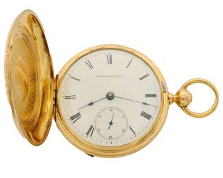 Lot 57: An 18k Gold  Waltham "P. S. Bartlett" model 1857 pocket watch.  18 size, 11 j, KW, KS, D & B, 18 K Gold HC with engraved detail, OF, Porcelain SSD with Roman numerals marked "American Watch Co.", serial #747133.  120.2 grams total weight, movement weighs 54.7 grams.  Some wear, minor denting, faint dial hairline, winds, sets and running when cataloged.  ESTIMATE $2,000-3,000
