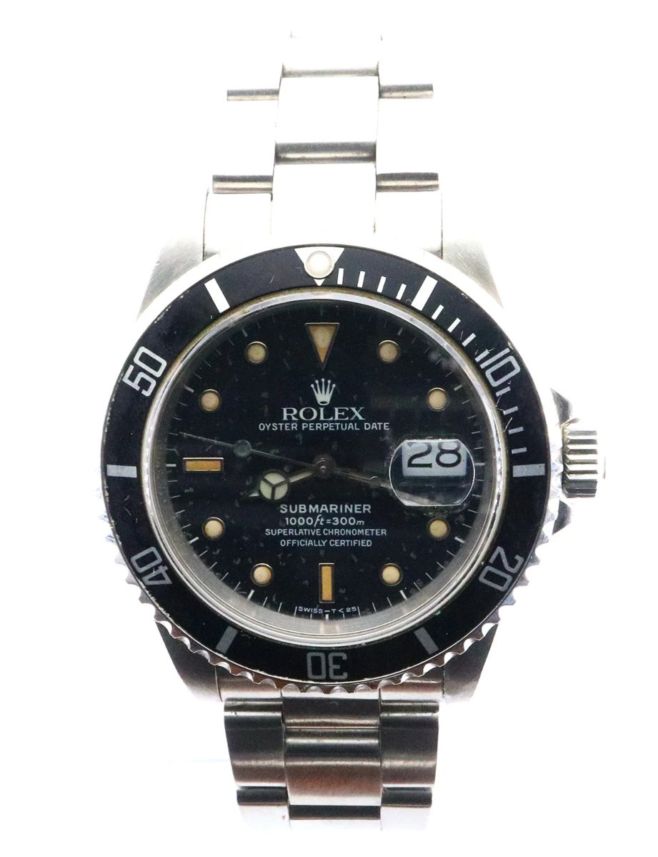 Lot 62:  A 1980's vintage Rolex Submariner Date model gentleman's wristwatch.  Automatic wind movement with a Black Tritium dial, Mercedes hands, Nipple markers, date aperture and sweep seconds, serial #R830240.  40 mm Stainless Steel case and a Rolex "Oyster" Stainless Steel bracelet.  Slight wear, replaced bezel, winds, sets and running when cataloged.  ESTIMATE $3,000-5,000
