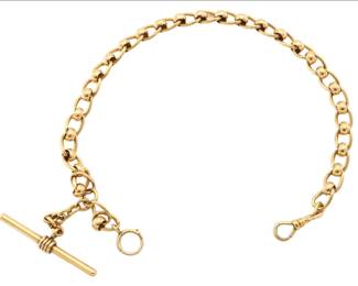 Lot 78: A 14k Gold watch chain.  Heavy T-bar chain with extra rolling links at each juncture.  60.3 grams total weight.  14 1/4" long overall.  Minor wear.  ESTIMATE $2,000-3,000
