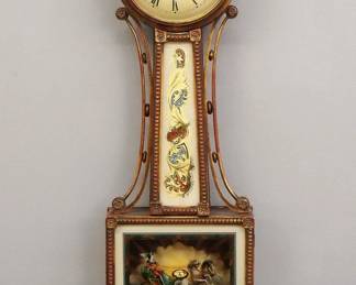 Lot 120: An early 20th century Waterbury Presentation Banjo clock.  8-day Brass, weight driven time only movement with convex painted iron dial and Roman numerals.  Gilded Mahogany case with shaped wooden arms, molded wood dial door with convex glass over reverse painted "Aurora" throat and lower door glasses, shaped drop with fluted detail.  Old finish with some wear, slight dial wear, running when cataloged.  38 1/2" high overall.  ESTIMATE $1,000-1,500
