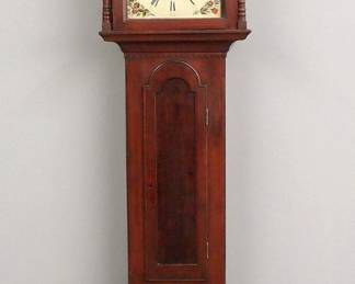 Lot 127: An early 19th century Pennsylvania Tall clock.  8-day time and strike movement with sweep second hand, painted Iron dial and Roman numerals, marked "A. W. Baldwin, Lampeter Square".  Mixed wood case with broken arch crest and turned finials over a shaped dial door flanked by turned columns, over an arched waist door and a paneled base with short turned feet.  Older refinishing with minor wear, some older repair, dial restored, running when cataloged.  95 1/4" high overall.  ESTIMATE $1,000-2,000
