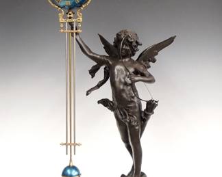 Lot 165: A late 20th century Bronze figural Swinging Arm clock.  8-day time only movement within a Blue enameled sphere with Roman numerals with gridiron pendulum and Brass mounts.  Cast Bronze figure of Cupid with dark Brown patina on a molded Marble plinth.  Some wear to the patina, replaced hanger, running when cataloged.  35 3/4" high overall.  ESTIMATE $600-800
