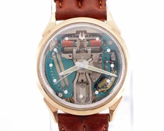 Lot 167: A vintage Bulova Accutron M3 "Spaceview" model gentleman's wristwatch.  Skeletonized Quartz movement with sweep seconds, Spaceview crystal with round markers, rear set, serial #H62070.  33 mm 10k Gold Filled case with a replaced leather band.  Minor wear, winds, sets and running when cataloged.  ESTIMATE $400-600
