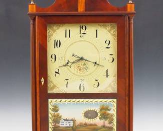 Lot 175: An early 19th century Seth Thomas Pillar and Scroll clock with off-center pendulum.  30-hr time and strike wooden strapwork movement with off-center pendulum and painted wooden dial.  Mahogany case with scrollwork top and Brass finials above a single door with clear dial glass and reverse painted lower flanked by slender turned columns on a scrolled base.  Paper label reading "E. Terry's Patent Clock, Made and Sold by Seth Thomas" 50% intact.  Refinished with restored crest, base, dial, hands and lower glass, replaced finials, not running when cataloged.  30 1/2" high overall.  ESTIMATE $600-800
