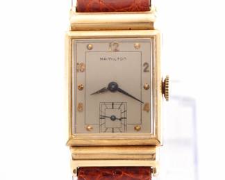 Lot 186:  A vintage Hamilton 14k Gold "Barton" model gentleman's wristwatch.  Manual wind, 19j, 982 movement with a Silvered dial, Round markers and subsidiary seconds, serial #M91666.  22 x 36 mm 14k Yellow Gold case with a replaced leather band.  28.2 grams total weight.  Slight wear, winds, sets and running when cataloged.  ESTIMATE $400-600
