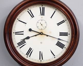 Lot 184:  A late 19th century Ansonia Gallery clock.  8-day time and strike movement with 18" painted metal dial and Roman numerals, subsidiary seconds.  Molded Mahogany case with lift door.  Some finish wear, minor dial wear, running when cataloged.  23" diameter.  ESTIMATE $600-800
