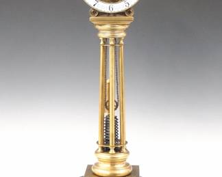Lot 190:  A 20th century Skeleton clock after the original by William Smith, Musselburgh (Scotland).  8-day spring driven fusee movement with porcelain chapter ring and Arabic numerals.  Brass columnar body on a stepped Grey Marble base with glass dome.  Minor wear, running when cataloged.  23 1/4" high overall.  ESTIMATE $400-600
