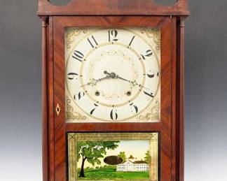 Lot 191:  A 19th century E. Terry & Sons Pillar and Scroll shelf clock.  30-hr weight driven wooden time and strike movement with painted wooden dial and Arabic numerals.  Mahogany case with scrolled crest and Brass finials, single door with clear dial glass and reverse painted lower flanked by slender turned columns on a scrolled base.  Facsimile paper label.  Older refinishing with minor damage, dial wear, restoration to crest and base, running when cataloged.  31 1/2" high overall.  ESTIMATE $400-600
