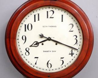 Lot 201:  A late 19th century Seth Thomas "Arcade" model Gallery clock.  30-day dual spring time only movement with 18" painted metal dial and Arabic numerals.  Molded case with lift door and original Mahoganized finish.  Some finish wear, minor dial wear, running when cataloged.  23 1/2" diameter.  ESTIMATE $600-800
