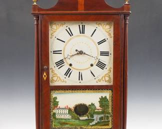 Lot 209: A 19th century Eli Terry Jr. Pillar and Scroll shelf clock.  30-hr weight driven wooden time and strike movement with painted wooden dial and Arabic numerals.  Mahogany case with scrolled crest and Brass finials, single door with clear dial glass and reverse painted lower flanked by slender turned columns on a scrolled base.  Paper label 80% intact.  Older refinishing with minor damage, dial wear, restoration to crest and base, replaced finials and lower door glass, running momentarily when cataloged.  31 1/2" high overall.  ESTIMATE $200-300
