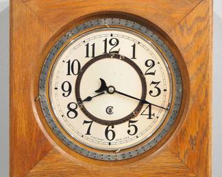 Lot 216: An early 20th century "CTR, Cincinnati, Ohio" Gallery clock.  Electric movement with metal dial and Arabic numerals.  Square Oak case with single molded door, serial #392048.  Old finish with minor wear, not tested.  16 1/2" high overall.  ESTIMATE $300-400
