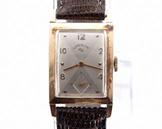 Lot 227: A vintage Lord Elgin 14k Gold gentleman's wristwatch.  Manual wind, 21j, 670 movement with a quartered Silvered dial, Square markers and subsidiary seconds, serial #P524088.  23 x 29 mm 14k Yellow Gold case with a replaced leather band.  24.8 grams total weight.  Some wear, winds, sets and running when cataloged.  ESTIMATE $300-400
