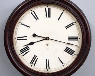 Lot 232:  A late 19th century Ansonia Gallery clock.  8-day time only movement with 18" papered metal dial and Arabic numerals.  Molded Oak case with lift door.  Paper label verso 60% intact.  Some finish wear, some dial damage, running when cataloged.  23" diameter.  ESTIMATE $300-400
