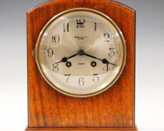 Lot 252: An early 20th century Chelsea table clock, retailed by Wright, Kay & Co. Detroit.  8-day time and strike movement with platform escapement, Silvered dial and Arabic numerals, serial #19954.  Simple Mahogany case with arched top and molded base.  Older finish with some wear, running when cataloged.  9 3/4" high overall.  ESTIMATE $200-300
