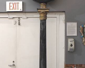 Lot 116: A late 20th century Reproduction Street clock.  Electric movement with two 21" painted metal dials and Arabic numerals.  Cast Aluminum stand with scrolled crest over a marque labeled "Witham Farms" (on one side) above a circular molded dial head on a tapered post with paneled base and paw feet.  Painted finish with wear and paint loss, running when cataloged.  136" high overall.  ESTIMATE $2,000-3,000
