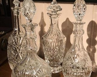 Nice collection of crystal decanters by Waterford and other makers