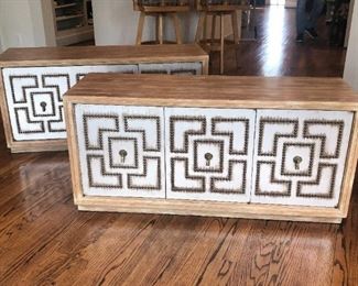 Pair of Mid-Century Modern credenzas with nail-head studded door panels