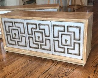 Pair of Mid-Century Modern credenzas with nail-head studded door panels