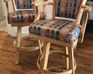 Pair of oak upholstered swivel barstools